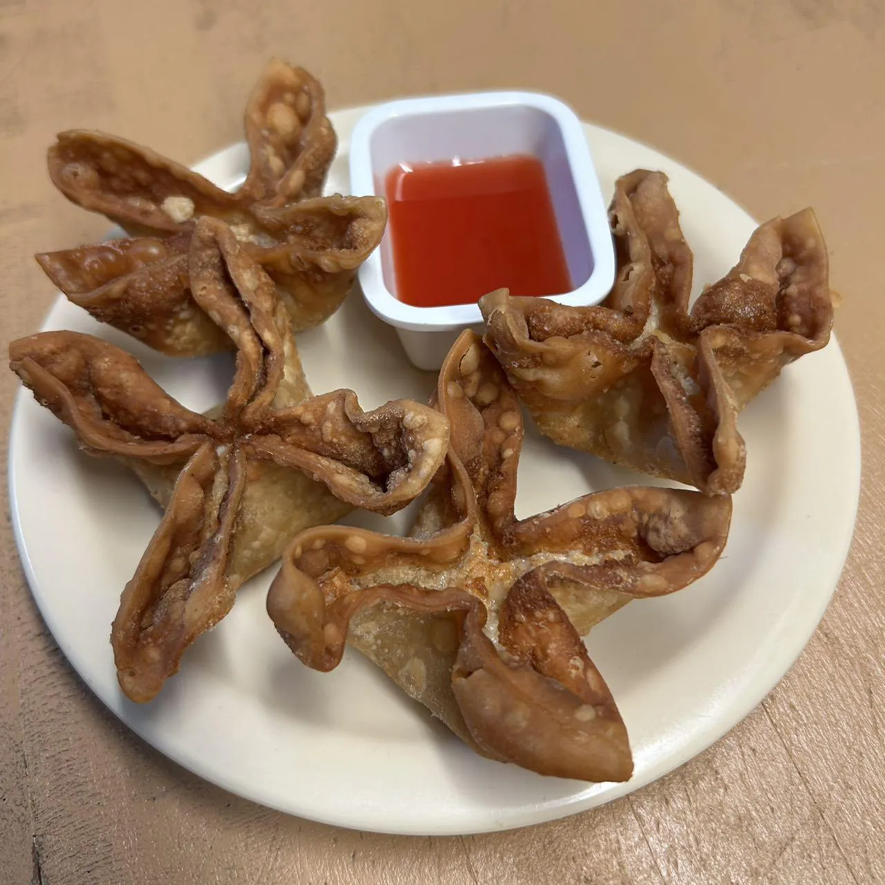 Crab Rangoon presents deep - fried wontons filled with crab meat at Asian Wok, a Chinese restaurant in Port Lavaca